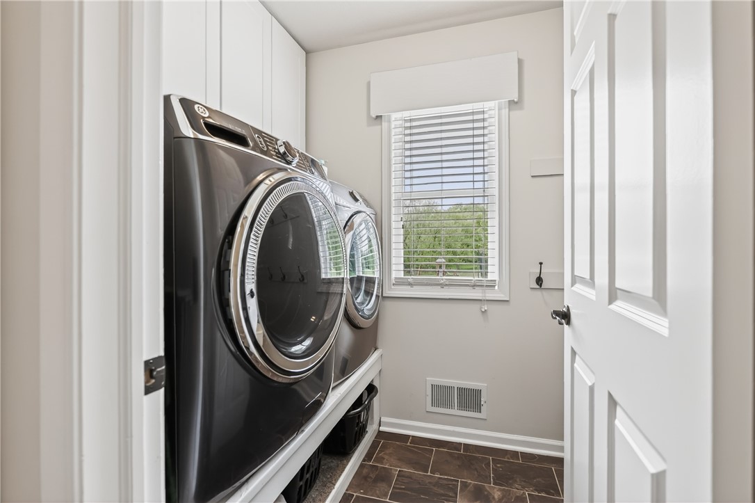 908 Taylor Rise Victor, NY 14564 - Photo 21 of 41 Laundry with Storage above and below. Also, a larg