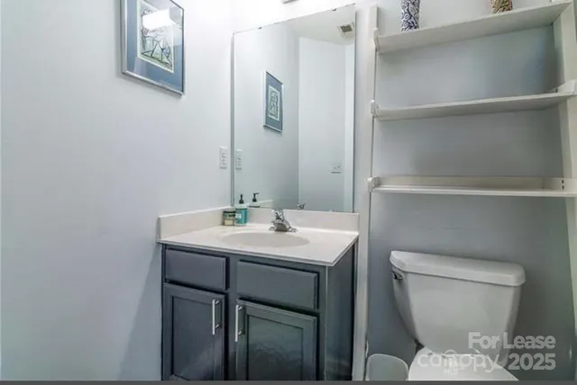 a kitchen with a table chairs stove and cabinets