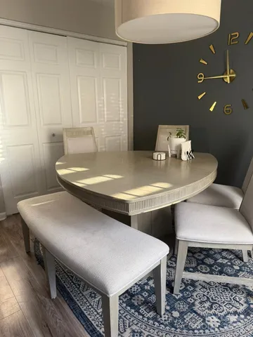 a kitchen with stainless steel appliances granite countertop a sink a stove and a refrigerator