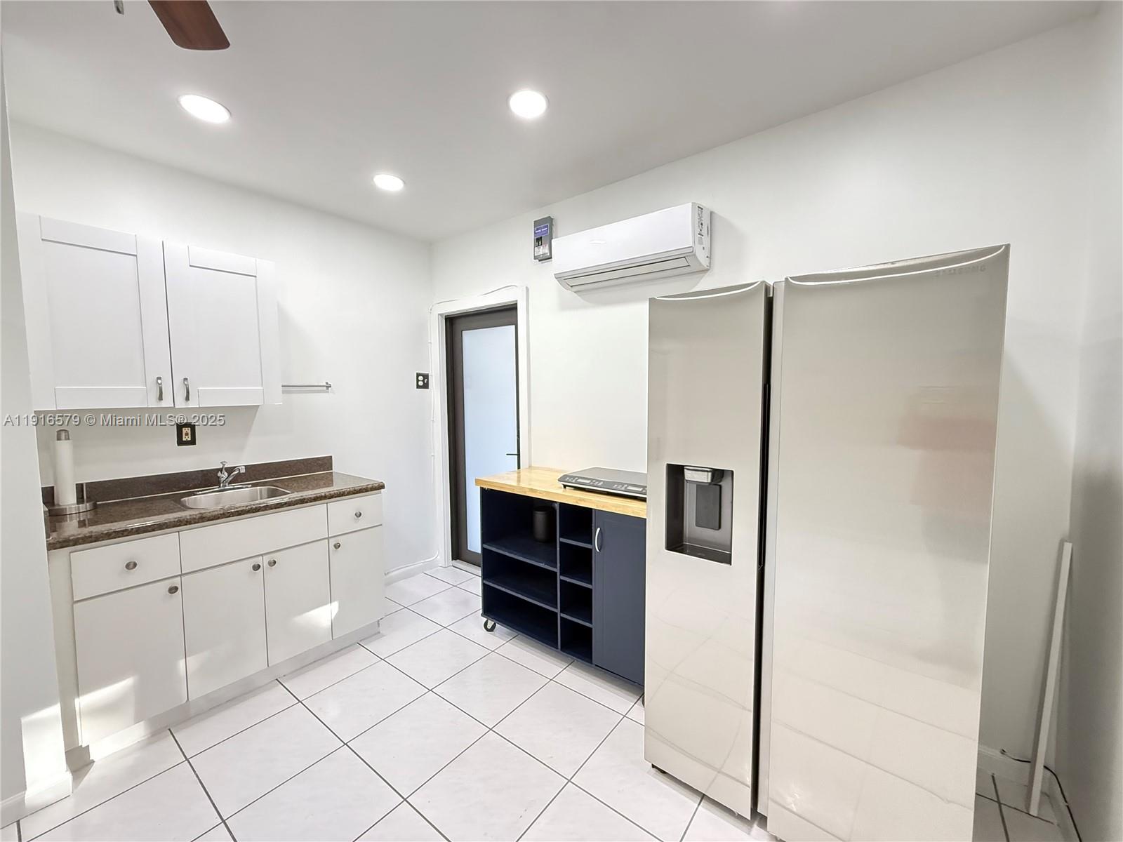 7680 Southwest 134th Court, Unit B Miami, FL 33183 - Photo 3 of 7 a large kitchen with stainless steel appliances a refrigerator and a sink