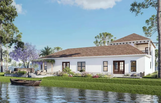 a front view of a house with a garden and plants