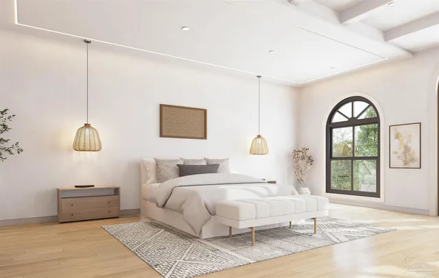 a bedroom with a large bed and a window