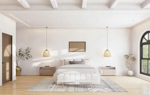 a bedroom with a large bed and a chandelier