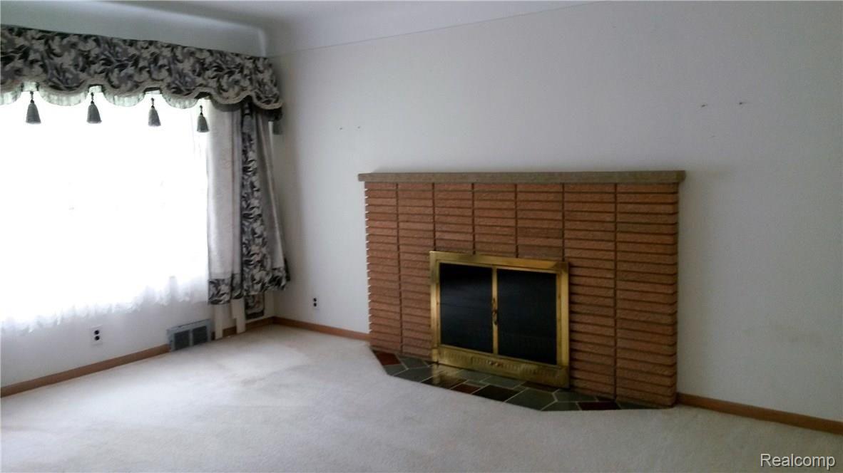 1195 Torpey Road Troy, MI 48083 - Photo 8 of 39 Family Room with Fireplace and Large Window facing yard.