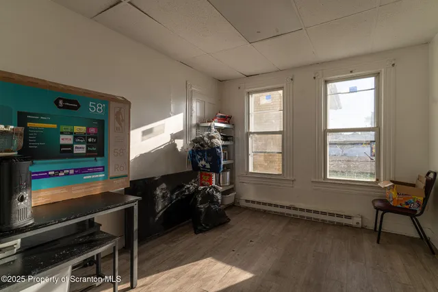 a bedroom with bed and a window