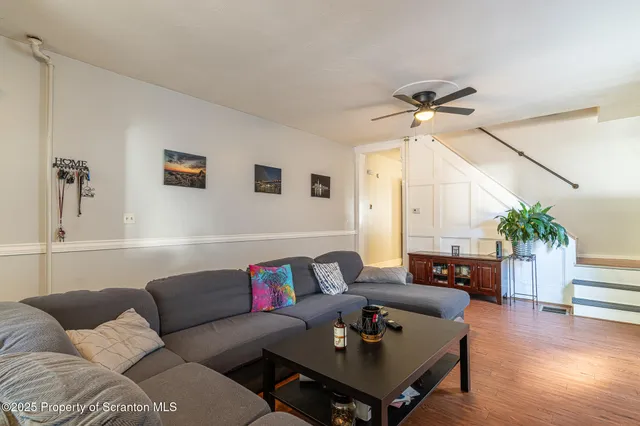 a kitchen that has a table and chairs in it