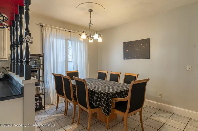 a kitchen with granite countertop a sink a stove and cabinets