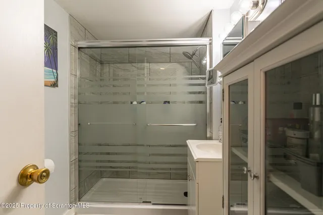 a bedroom with a bed and a desk