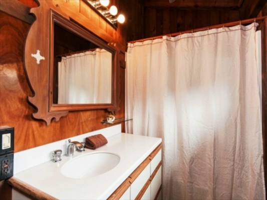 3968 Anini Road, Unit B Princeville, HI 96722 - Photo 15 of 23 a bathroom with a sink and a mirror