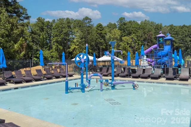 a view of a park with swings and slides