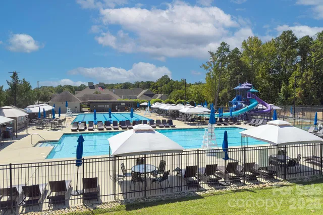 a view of a swimming pool with a patio