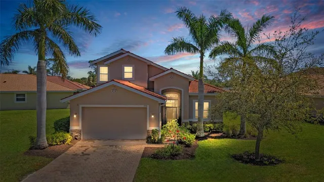 a front view of a house with a yard and porch