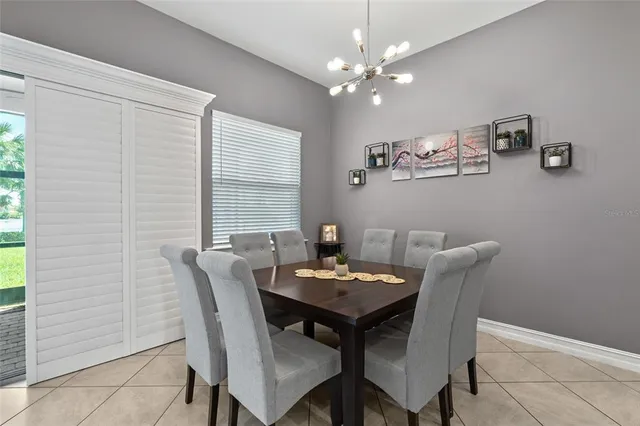 a bathroom with a granite countertop sink and a mirror with toilet