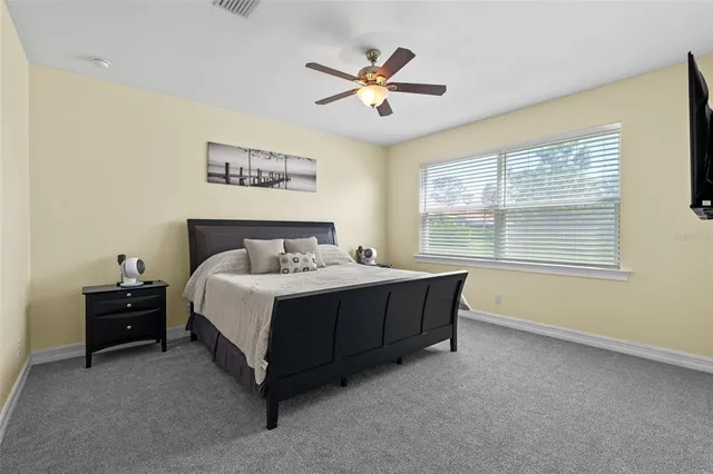 a spacious bathroom with a tub sink shower and mirror