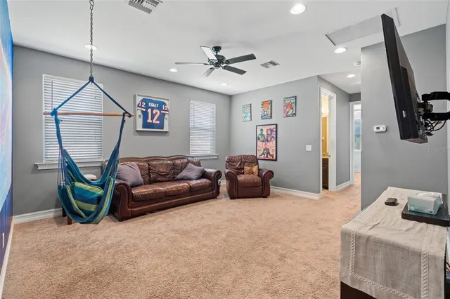 a bedroom with a bed next to a window