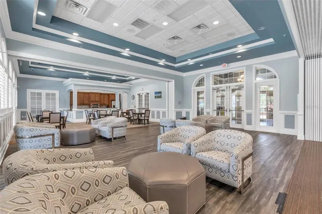 an aerial view of a house with a yard and lake view