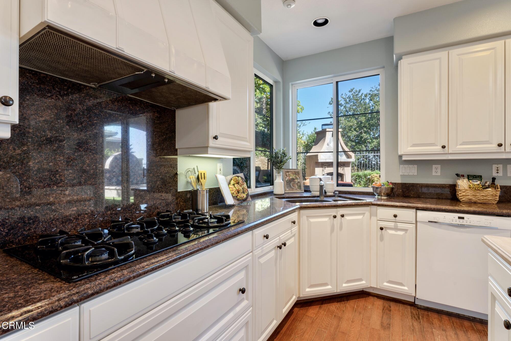 3658 Giddings Ranch Road Altadena, CA 91001 - Photo 21 of 53 a kitchen with white cabinets and a stove