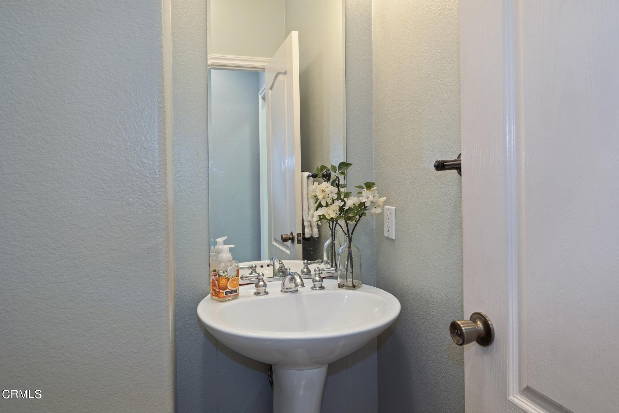 3658 Giddings Ranch Road Altadena, CA 91001 - Photo 28 of 53 a bathroom with a sink a mirror and a toilet