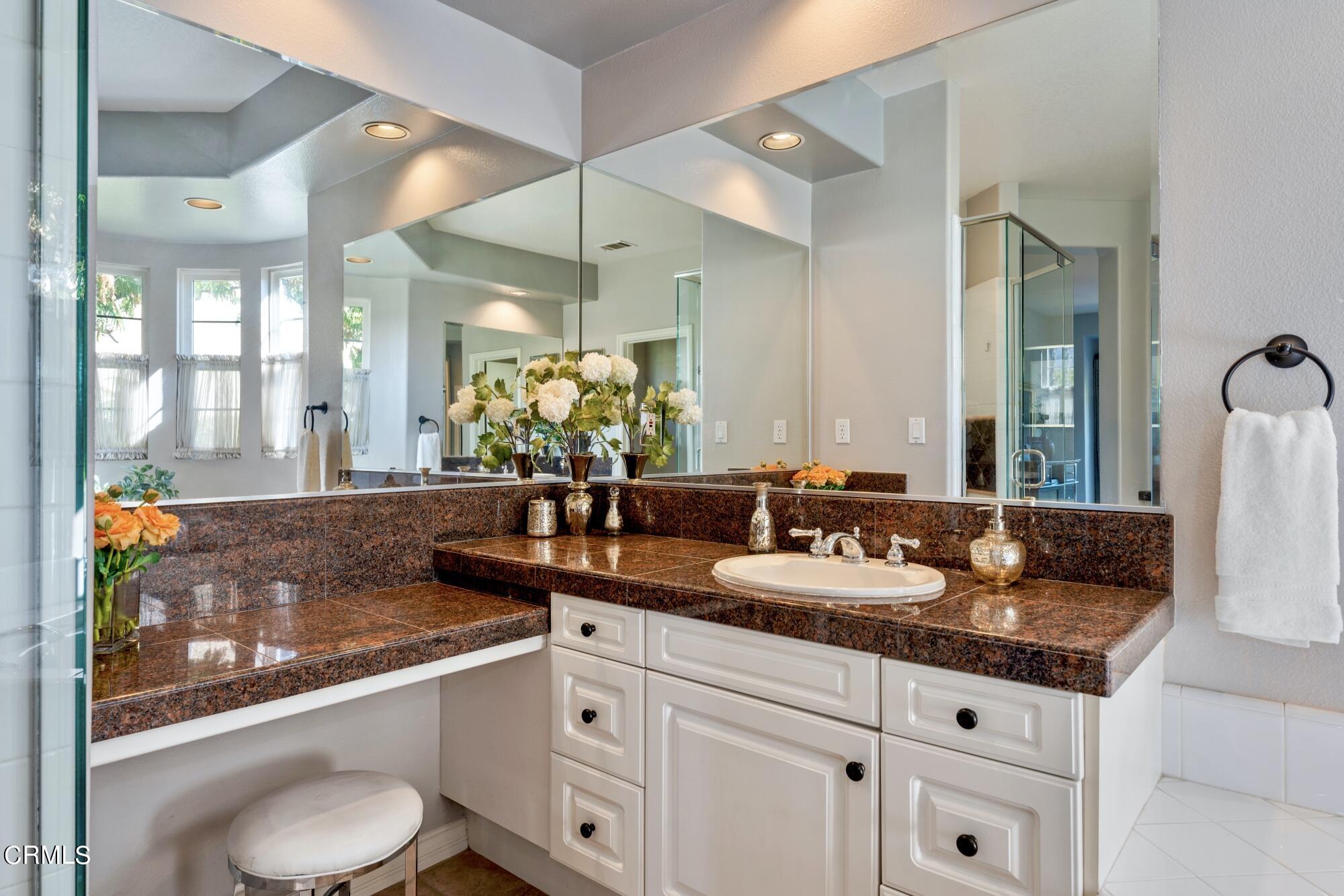 3658 Giddings Ranch Road Altadena, CA 91001 - Photo 38 of 53 a bathroom with a granite countertop sink and a mirror
