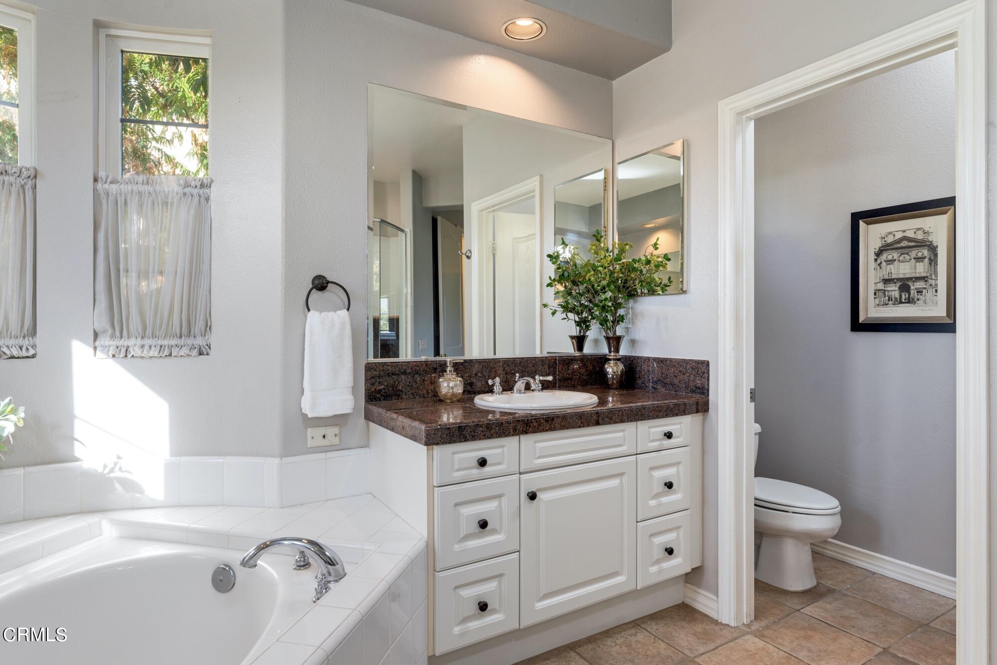 3658 Giddings Ranch Road Altadena, CA 91001 - Photo 39 of 53 a bathroom with a granite countertop sink and a bathtub