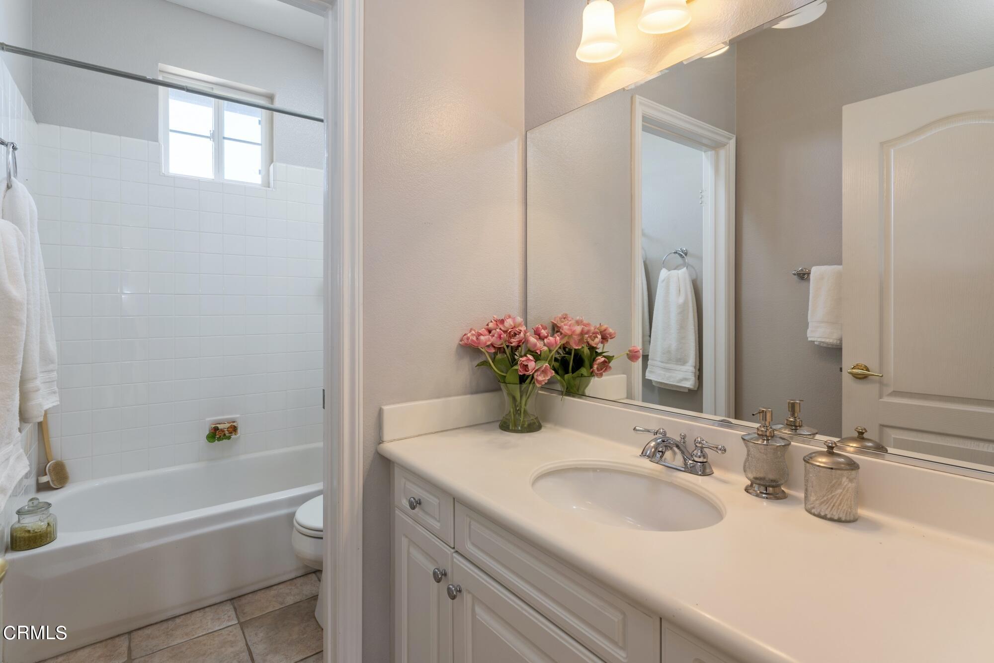 3658 Giddings Ranch Road Altadena, CA 91001 - Photo 43 of 53 a bathroom with a sink and a mirror