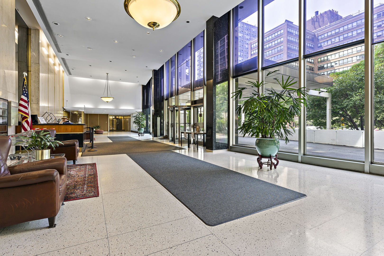 5701 North Sheridan Road, Unit 21D Chicago, IL 60660 - Photo 2 of 29 a lobby with furniture and floor to ceiling window