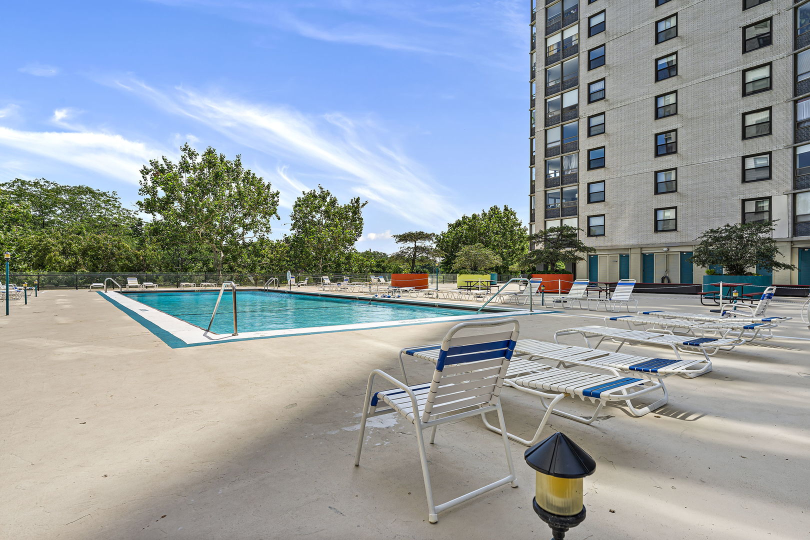 5701 North Sheridan Road, Unit 21D Chicago, IL 60660 - Photo 21 of 29 a view of a swimming pool with a lounge chair