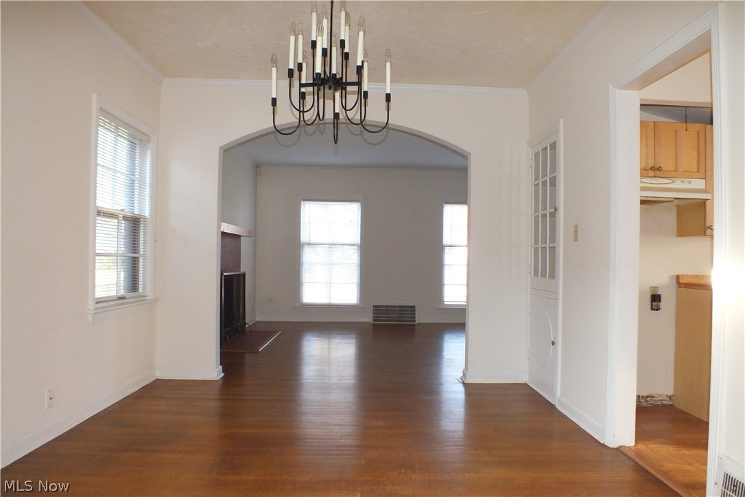 3844 Bethany Road Cleveland, OH 44118 - Photo 9 of 35 The formal dining room with hardwood floor and built-in china display cabinet. The kitchen entrance is at right