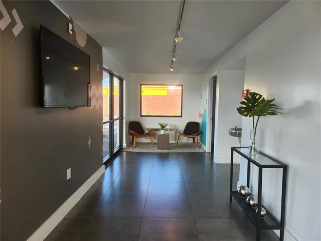 a work room with furniture and a window