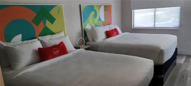 a view of a brick building next to a yard