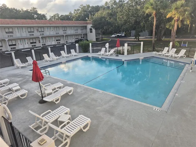 a view of a patio with chairs and a table