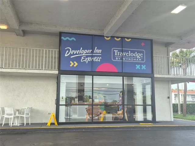 a view of a store with a street