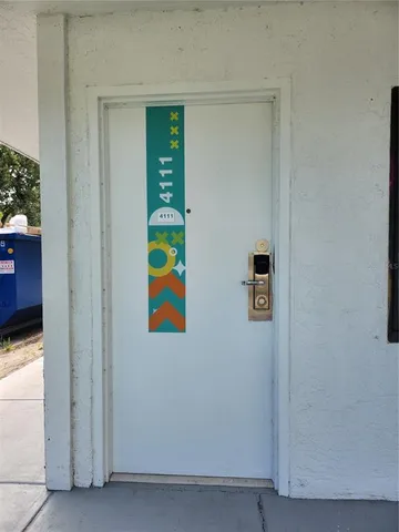 a dining room with furniture and a mirror