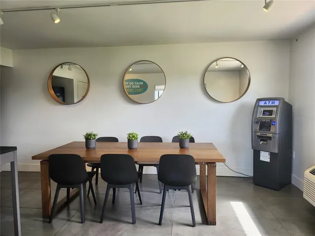 a view of a dining room with furniture and window