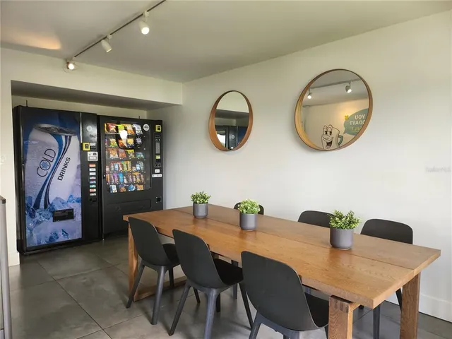 a dining room with furniture and window