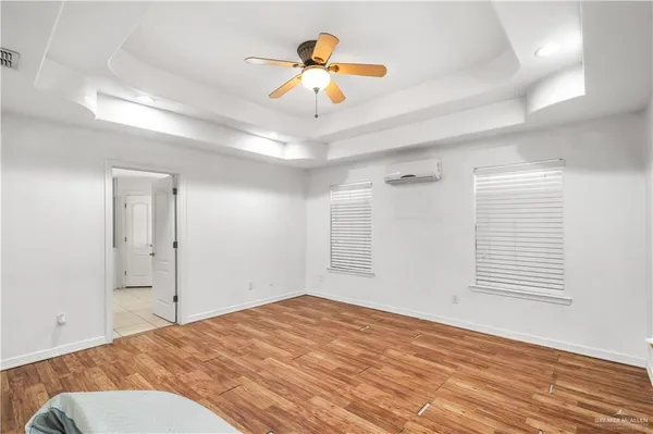 a view of a room with a ceiling fan