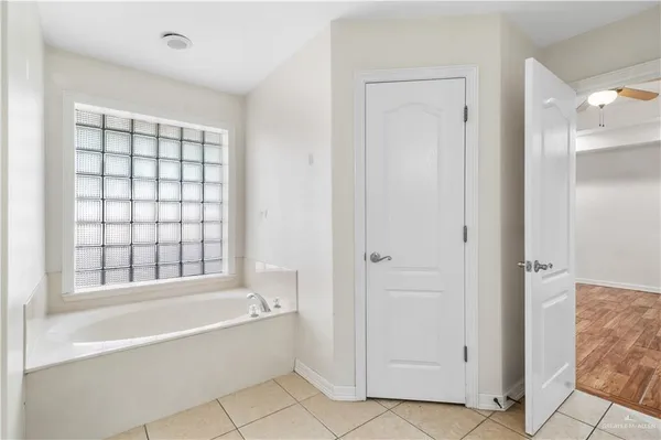 a bathroom with a bathtub and shower