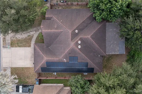 an aerial view of a house with a yard and sitting area