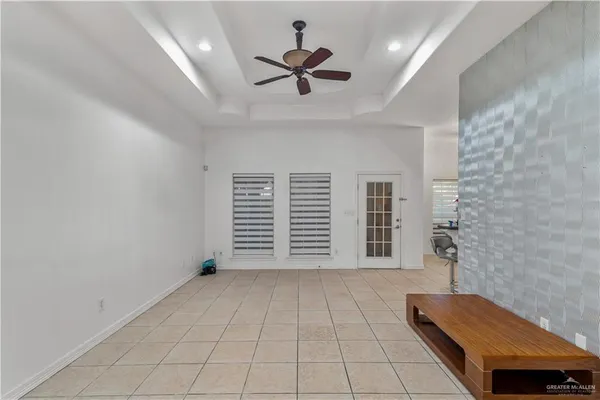 a view of an empty room with a window