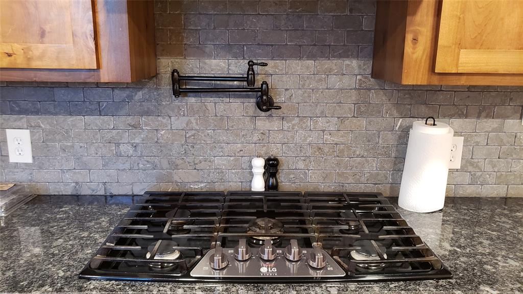 1440 South Keller Road Mineral Wells, TX 76067 - Photo 12 of 24 a close up of a stove