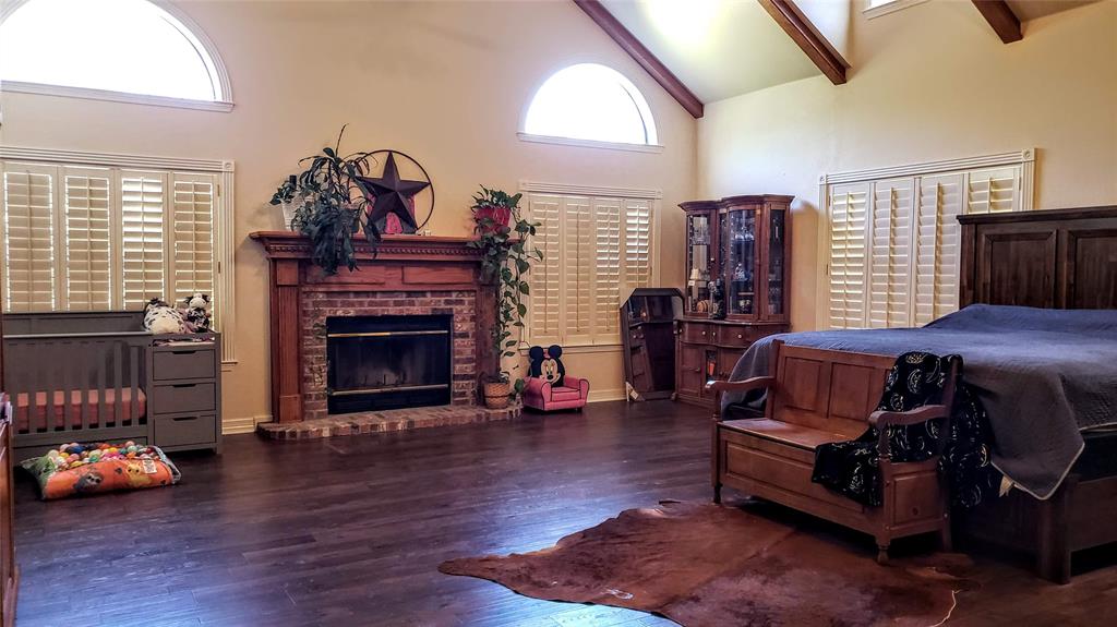 1440 South Keller Road Mineral Wells, TX 76067 - Photo 15 of 24 a living room with furniture and a fireplace