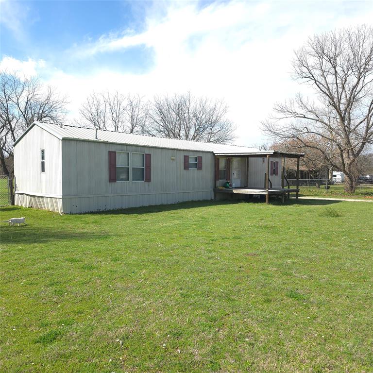 1440 South Keller Road Mineral Wells, TX 76067 - Photo 22 of 24 a front view of house with yard and trees