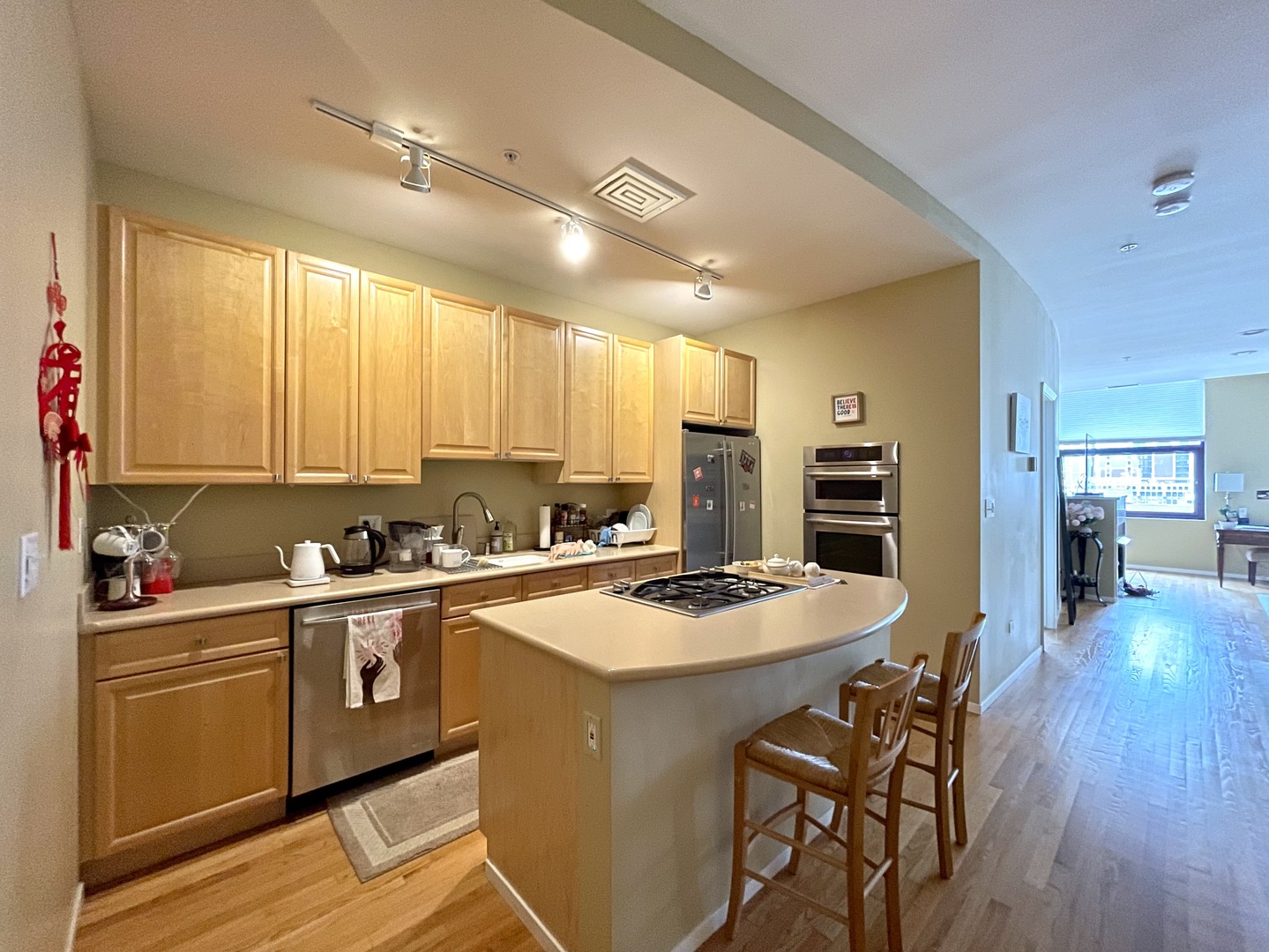 Undisclosed Address Chicago, IL 60604 - Photo 4 of 14 a kitchen with a sink a stove cabinets and wooden floor