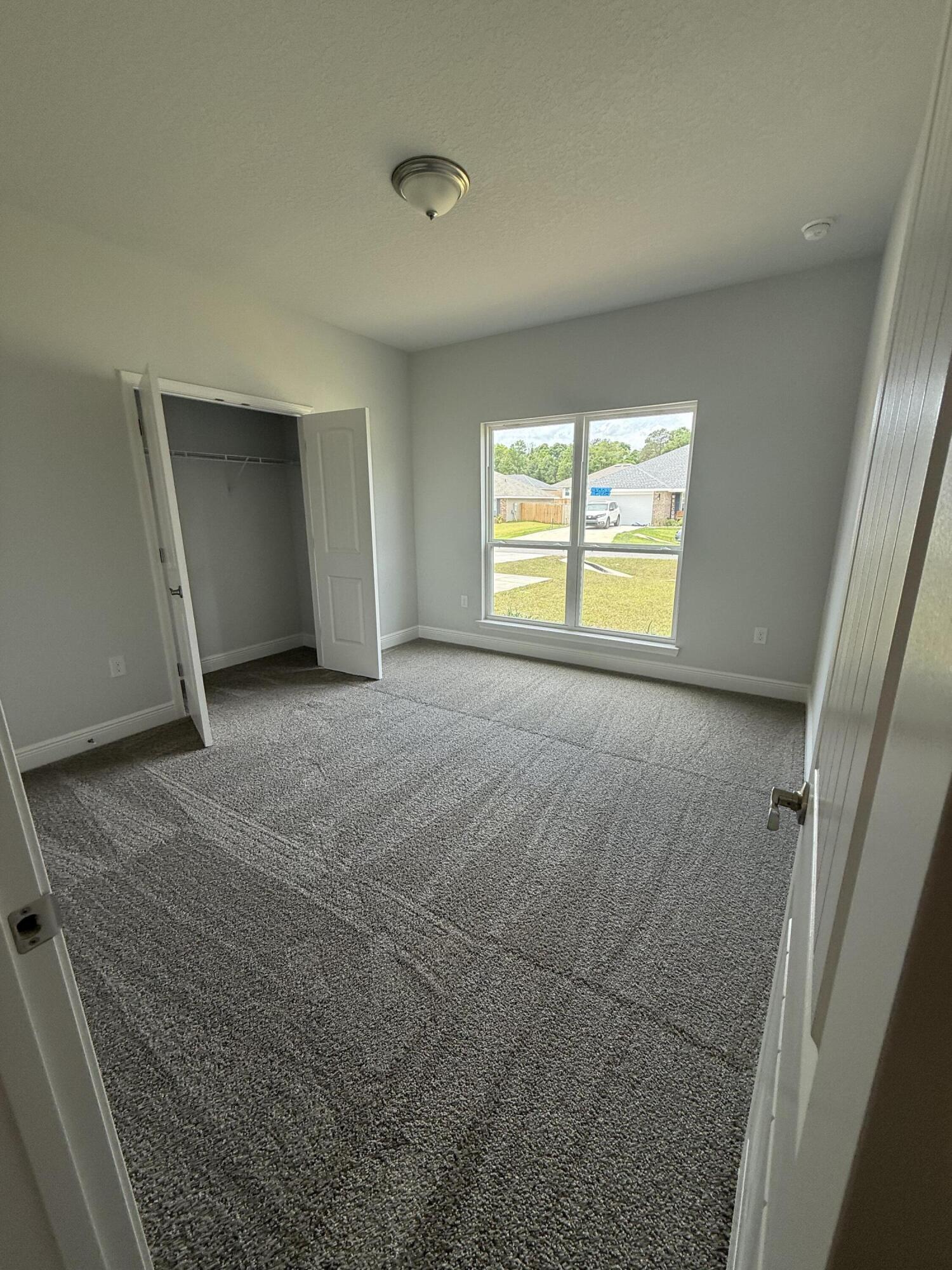 6004 Crocket Cove Crestview, FL 32539 - Photo 14 of 24 a view of an empty room with a window