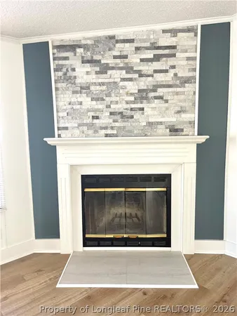 a view of a fireplace in an empty room
