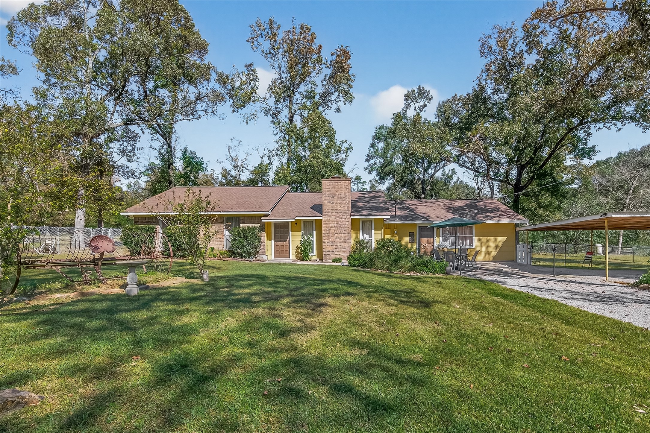 11535 Willis Waukegan Road Conroe, TX 77303 - Photo 1 of 47 a front view of a house with a yard