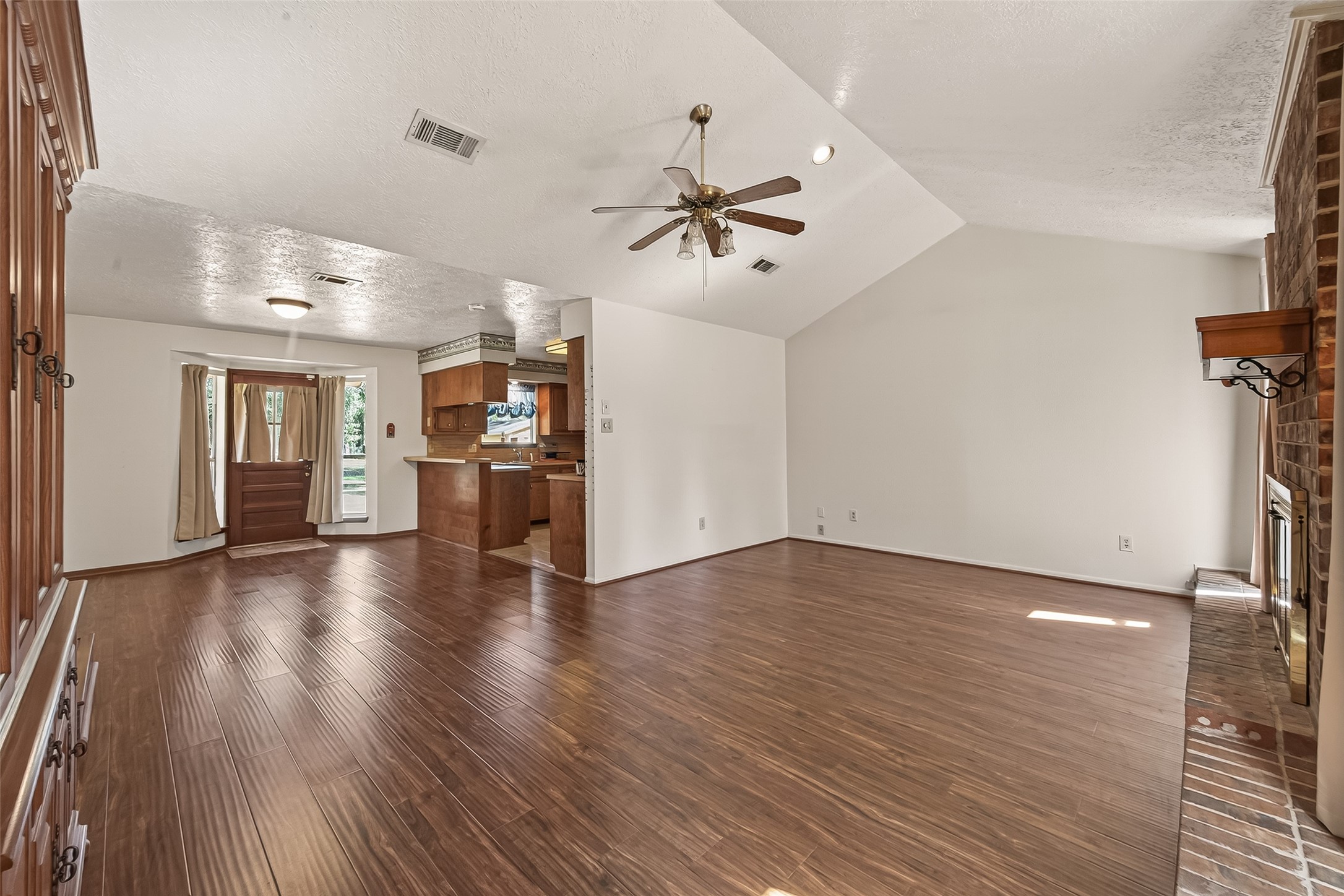 11535 Willis Waukegan Road Conroe, TX 77303 - Photo 13 of 47 wooden floor in an empty room with a window
