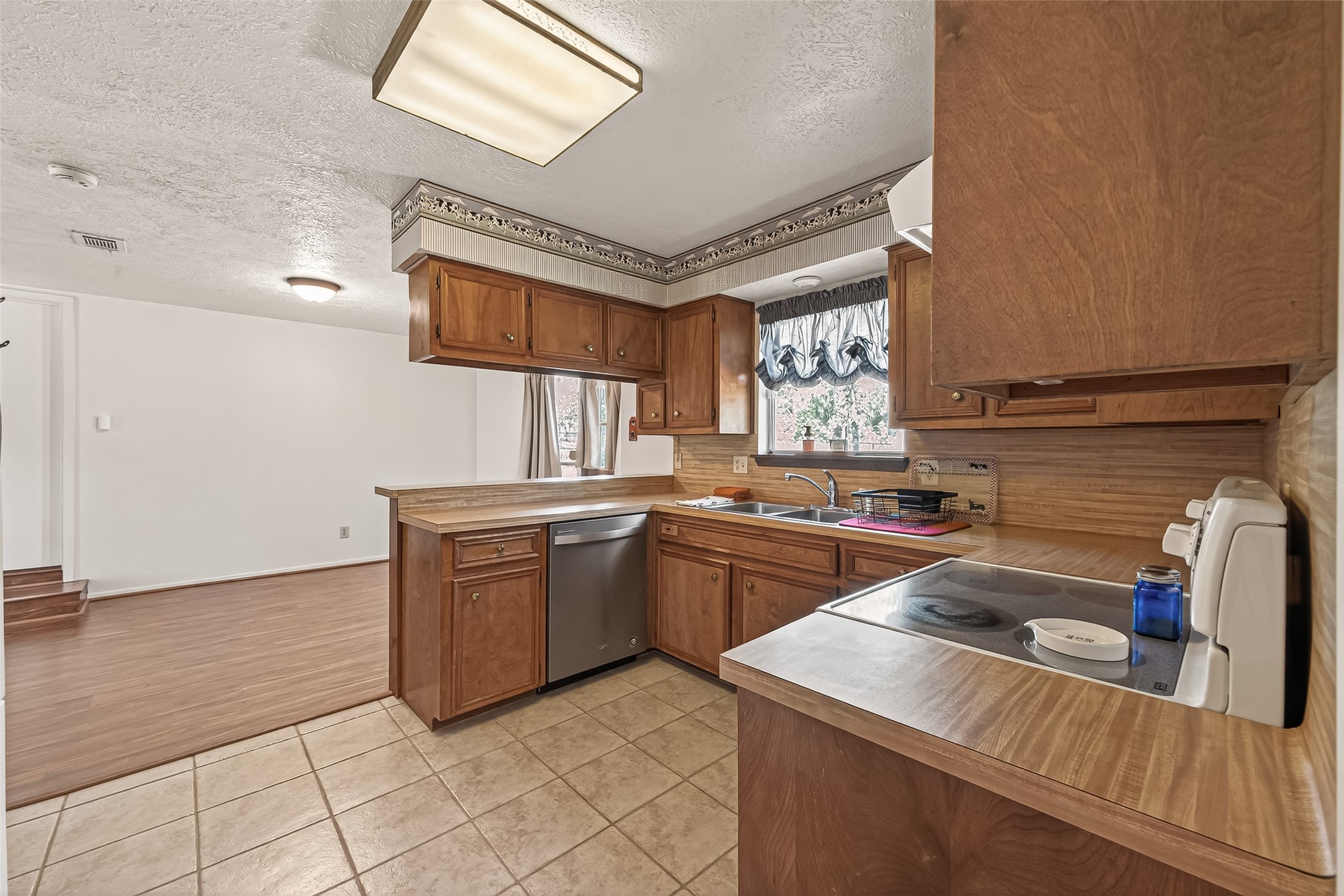 11535 Willis Waukegan Road Conroe, TX 77303 - Photo 20 of 47 a kitchen with a sink stove and cabinets
