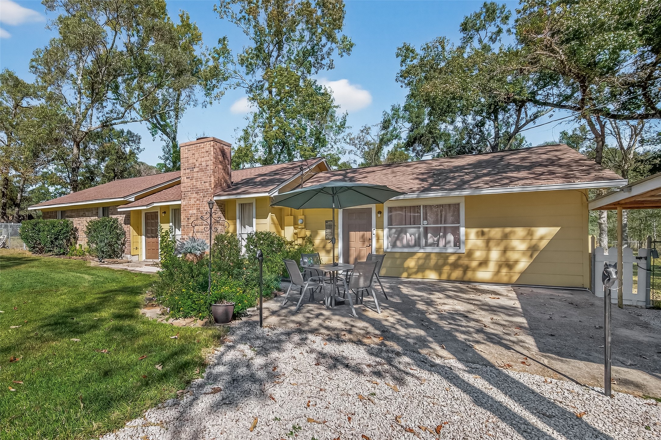 11535 Willis Waukegan Road Conroe, TX 77303 - Photo 2 of 47 a front view of a house with garden