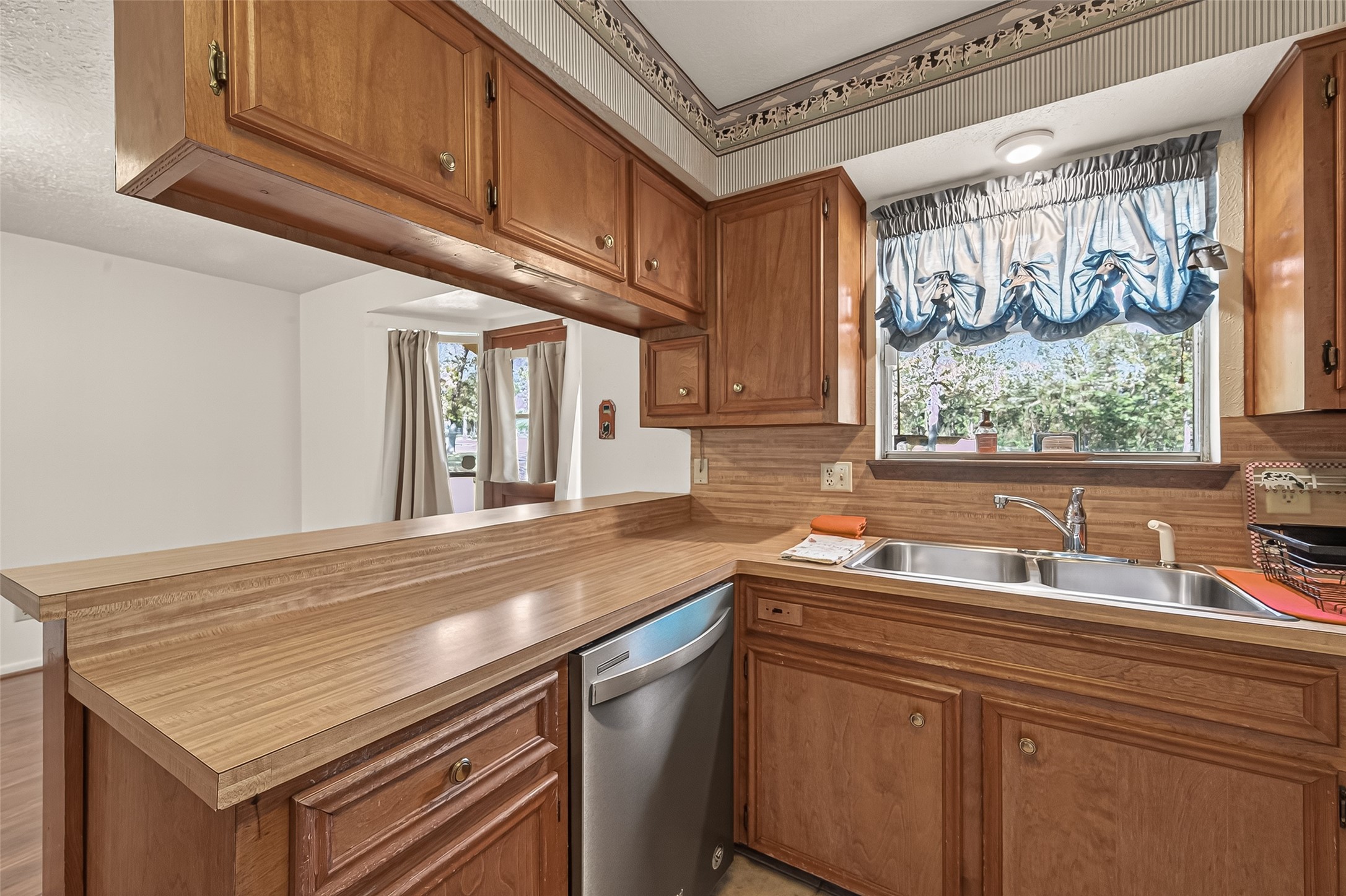 11535 Willis Waukegan Road Conroe, TX 77303 - Photo 21 of 47 a kitchen with stainless steel appliances granite countertop a sink and cabinets